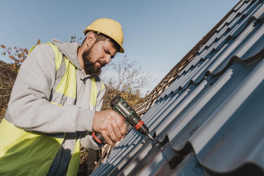 sideways-man-working-roof-with-drill